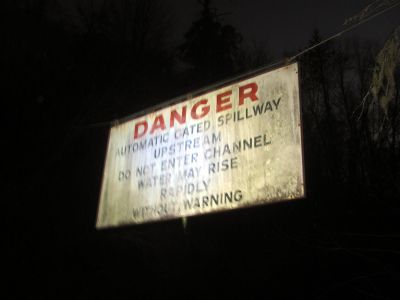 Sign near the dam taken with falsh in total darkness. 
