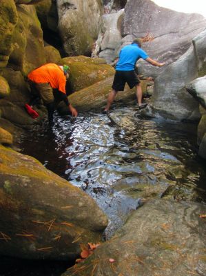 Crossing the pool in the gut of the slot canyon 
