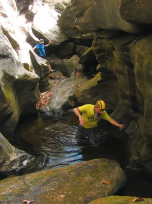 John make quick work of crossing the ice cold water pool deep in the slot canyon 
