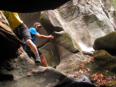 Live action shot shows the precarious nature of maneuvering around within the  deep slot canyon 
