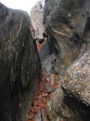 log wedged in top right of the blockage rock 

