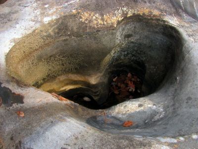 Some potholes are deep with smooth sides and you would most likely not be able to get yourself out if you fell in and were without help. 
