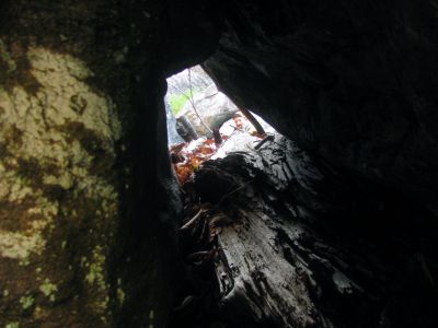 Another keyhole crack we had to squeeze thru . You can see Johns face on the other side ! 
