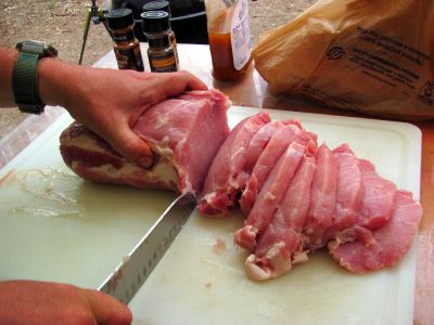OX slices the boneless pork loin 
