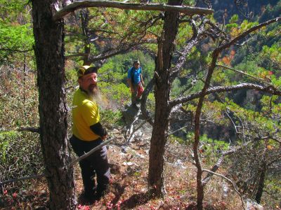 After a considerable climb farther down the cliff spine we discovered what we call the Diamond Rock. Here is Tyler as he stands upon it with John looking on. You can see the elation in John`s face ! 
