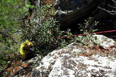 John going down the crack on the rope 

